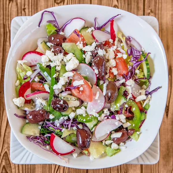 Habibi's Cafe & Pizzeria's fresh salad with feta, olives, radishes, and mixed greens.